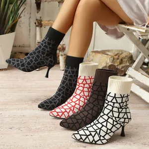 Stylish pointed-toe stretch fabric high heel ankle boots with multiple geometric patterns.