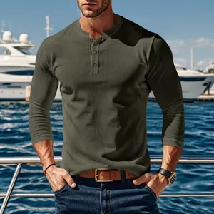 Close-up of men's olive green ribbed Henley shirt with long sleeves and buttons.