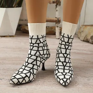 Elegant pointed-toe stretch knit ankle boots with a stylish geometric pattern and slim heels.