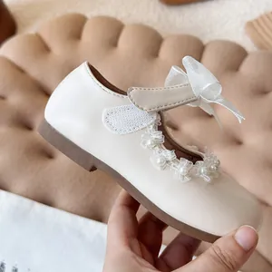 Elegant white girls' princess shoes with decorative pearls and lace bow detailing