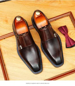 Detailed view of burnished brown leather double monk strap shoes with square toe.