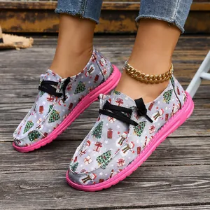 Comfortable women's casual Christmas print canvas loafers with vibrant pink soles