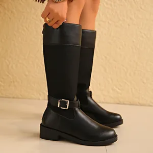 Side detail of black knee-high knight boots with buckle strap and fabric splicing