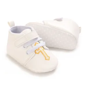 Elegant white baby christening shoes with gold cross embroidery and non-slip soles