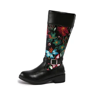 Floral embroidered black knee-high boots with silver buckle strap and low heel design