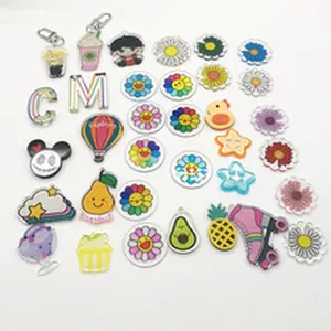 Detailed view of various colorful acrylic keychain charms featuring cute and vibrant designs