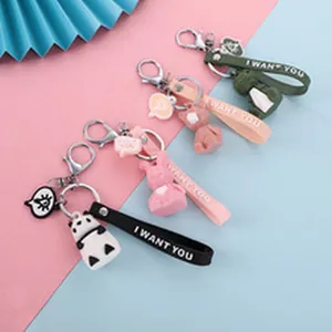 Set of four cute cartoon animal silicone keychains featuring panda and rabbit designs