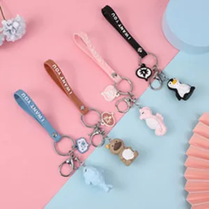 Detailed view of four colorful animal keychains with 'I WANT YOU' straps for bags and gifts