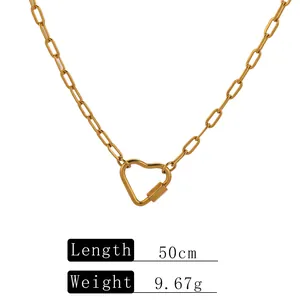 Close-up of gold stainless steel paperclip chain necklace with heart clasp and specs