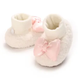Soft white fleece baby shoes with oversized pink satin bow for girls 0-1 year old