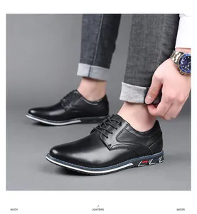 Detail shot of black men's business casual leather shoes with decorative sole accents