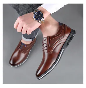 Close-up of brown men's business casual leather derby shoes with decorative stitching