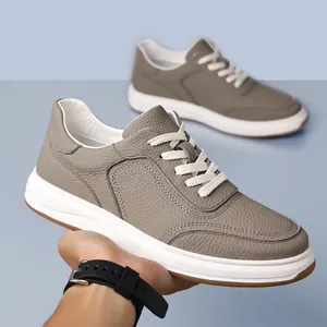 Premium grey textured leather men's casual sneakers featuring white soles and laces.