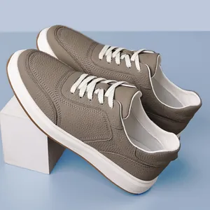 Men's pebbled leather casual shoes in taupe featuring white laces and thick rubber soles