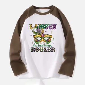 Detailed view of Mardi Gras mask and French text heat transfer on a raglan sleeve shirt