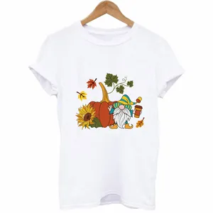 Thanksgiving gnome and pumpkin iron-on heat transfer pattern shown on a white T-shirt