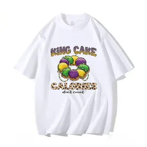Detailed print of Mardi Gras King Cake with festive leopard text on a white t-shirt.