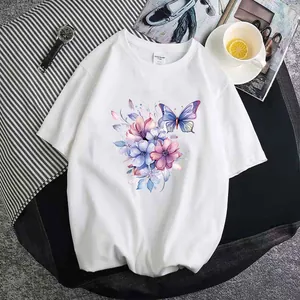 Detailed view of watercolor butterfly and floral print on white t-shirt lifestyle