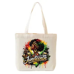 Detailed view of colorful Juneteenth graphic decal applied to a canvas tote bag
