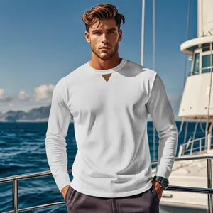 Detailed view of white corduroy men's long sleeve shirt with triangle neck patch