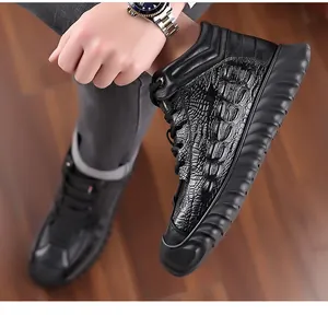 Close-up detail of men's black high-top winter leather boots with crocodile texture
