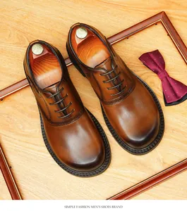 Top view detailed view of elegant hand-burnished brown leather Oxford shoes for men