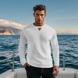 Detail of white men's corduroy long-sleeve top with decorative leather neckline patch