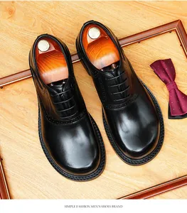 Close-up of premium black leather Oxford shoes for men with elegant brogue details