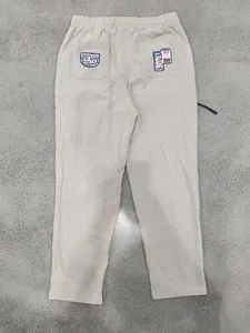 Back view of men's loose linen casual pants with graphic pocket patches