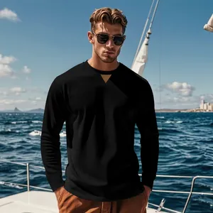 Close-up detail of men's black ribbed corduroy long sleeve top worn by model on a yacht.