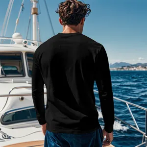 Back view of a men's black corduroy long sleeve shirt on a sunny luxury yacht deck