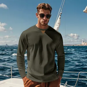 Detailed view of men's olive green corduroy crew neck long sleeve shirt on yacht