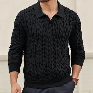 Detail of a black men's cable knit polo sweater showing the textured long sleeves and collar.