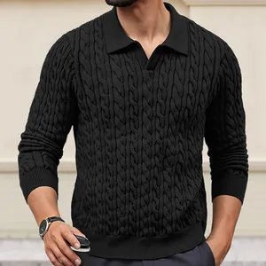 Close-up view of a black cable-knit long-sleeve polo sweater showing texture details