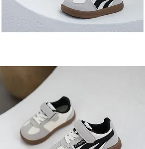 Close-up detail of children's grey and cream sneakers with non-slip gum soles.