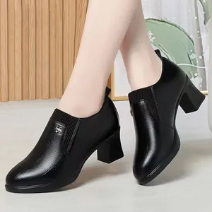 Stylish black block-heel commuting loafers with textured finish and side elastic detail.