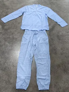 Flat lay of a light blue long-sleeve linen Henley shirt and drawstring pants set
