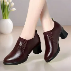 Elegant burgundy pointed toe chunky heel loafers for women shown in a clean indoor setting