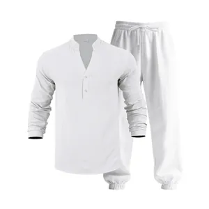 Detailed view of white loose linen men's Henley shirt and drawstring trousers set