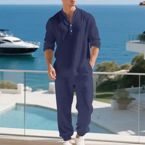 Close-up of the textured navy linen fabric and fit of this relaxed men's Henley set