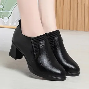 Elegant black textured leather loafers with chunky heels and elastic side gussets