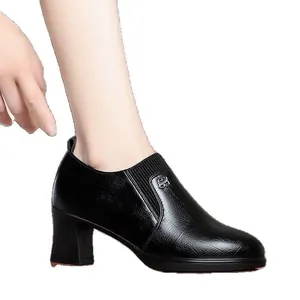 Elegant black leather block heel loafers for women with pointed toe and side logo detail