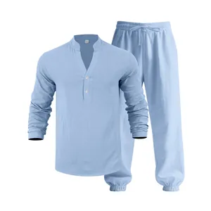 Detail view of light blue linen-like Henley long-sleeve shirt and matching pants.