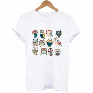 Detailed macro view of colorful cartoon owl heat transfer prints on a white cotton T-shirt