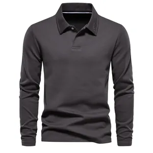 Close-up detail of a men's dark grey long-sleeve polo shirt featuring a classic lapel collar