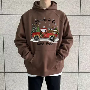 Casual brown oversized hoodie featuring a festive Christmas red truck graphic and text