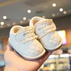 Cream quilted leather baby walking shoes with delicate lace trim and heart velcro strap