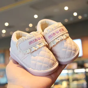 Pink baby girl walking shoes with soft quilted leather and decorative lace detailing
