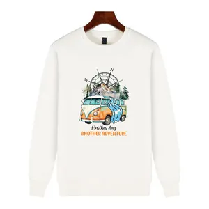 Detailed view of camping bus and compass heat transfer decal on a white sweatshirt