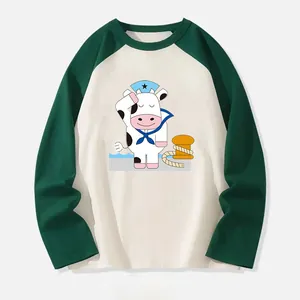 Cute cartoon sailor cow heat transfer patch on a raglan long sleeve shirt for custom apparel